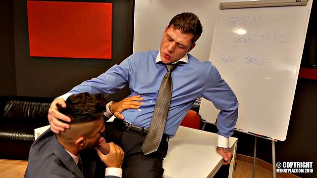 two suited men have intense office sex