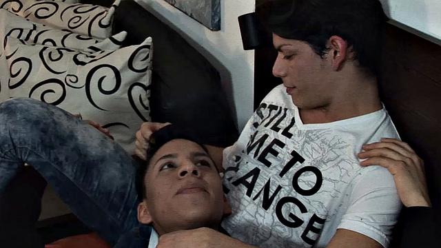 We look in two young Latinos Etienne and Dylan hanging out on the bed. Soon lust takes over and the boys begin making out, as their clothes start peeling off. Dylan goes down on Etienne's big uncut cock and quickly has it sucked stiff.