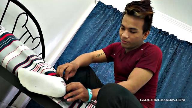 This hunky super cute Asian boy has some perfect Asian male feet. Derik is dark and handsome, so you're going to love this masculine Asian hunk as he slowly removes his shoes and socks up close to the camera for you.