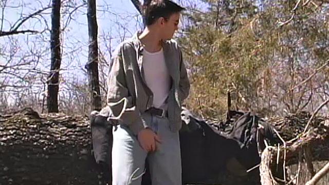 When 18 year old Derrick Windsor is out hiking in the woods, he gets the urge to jerk off. The young man looks around and sees he's alone, so he leans on a fallen tree and pulls down his pants just enough to work his growing cock.