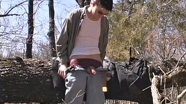 When 18 year old Derrick Windsor is out hiking in the woods, he gets the urge to jerk off. The young man looks around and sees he's alone, so he leans on a fallen tree and pulls down his pants just enough to work his growing cock.