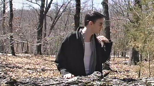 When 18 year old Derrick Windsor is out hiking in the woods, he gets the urge to jerk off. The young man looks around and sees he's alone, so he leans on a fallen tree and pulls down his pants just enough to work his growing cock.