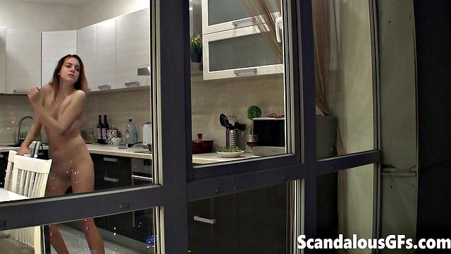 Watching my neighbor's sexy girlfriend goofing around naked in the kitchen