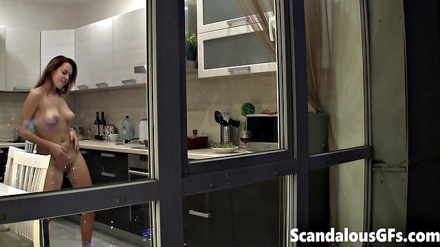 Watching my neighbor's sexy girlfriend goofing around naked in the kitchen