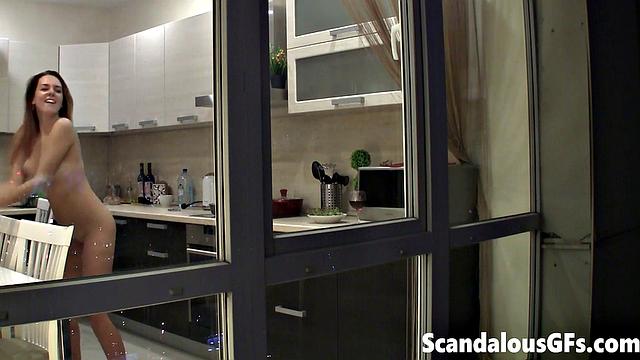 Watching my neighbor's sexy girlfriend goofing around naked in the kitchen