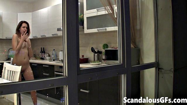 Watching my neighbor's sexy girlfriend goofing around naked in the kitchen