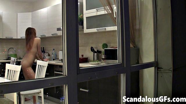 Watching my neighbor's sexy girlfriend goofing around naked in the kitchen
