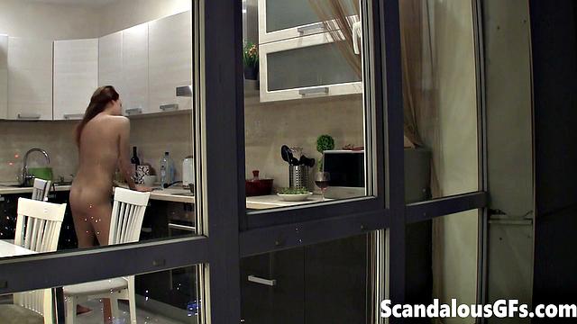 Watching my neighbor's sexy girlfriend goofing around naked in the kitchen