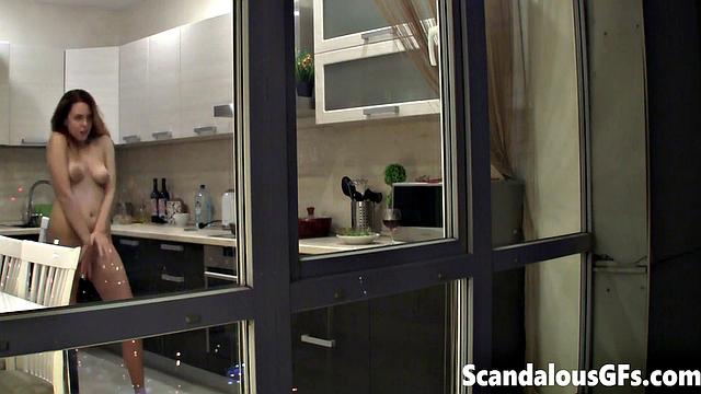 Watching my neighbor's sexy girlfriend goofing around naked in the kitchen