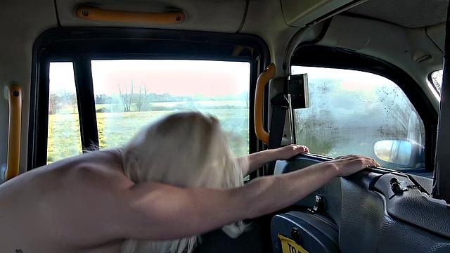Blonde MILF in high heels gets her bald pussy pounded in a taxi