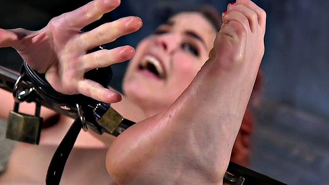 Tied up ginger babe dildo-fucked after feet spanking