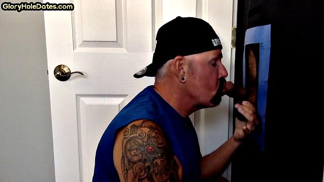 Tattooed gloryhole DILF sucks and wanks cock