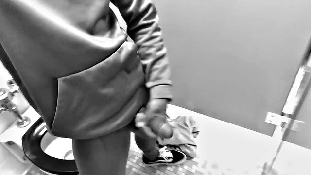 Filmed in black and white, Chris is in a public bathroom to show us his stuff. Already sporting a big boner, he drops to reveal a beautiful dick and fine ebony butt.