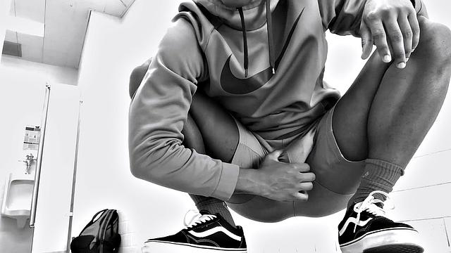 Filmed in black and white, Chris is in a public bathroom to show us his stuff. Already sporting a big boner, he drops to reveal a beautiful dick and fine ebony butt.