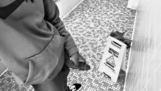Filmed in black and white, Chris is in a public bathroom to show us his stuff. Already sporting a big boner, he drops to reveal a beautiful dick and fine ebony butt.