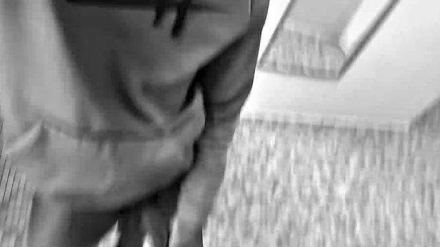 Filmed in black and white, Chris is in a public bathroom to show us his stuff. Already sporting a big boner, he drops to reveal a beautiful dick and fine ebony butt.