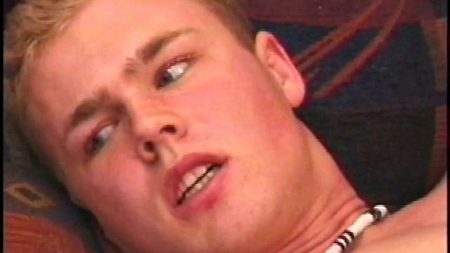 Relaxing on the couch, Brett Peters announces that he hasn't gotten off in a few days and that he really wants to blow a load on his face. That big floppy dick doesn't turn into a major stiffy until his fingers find his ass.