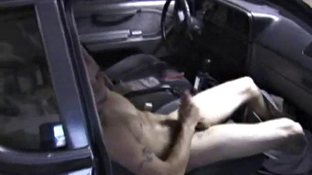 Bradley Shaw finds the passenger seat of a car the perfect spot for some private time. With the car parked in a garage, Bradley watches some porn to help keep him stimulated.