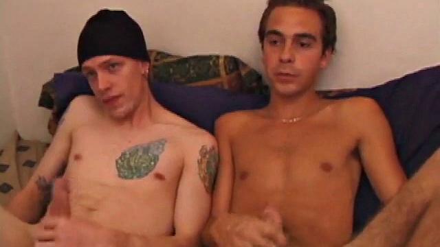 Shane and Vincenzo on the bed, with the goal to end up covering each other's faces in cum. They start watching a porn video and rub their stiff cocks through their pants. The clothes become too restraining and soon they come off.