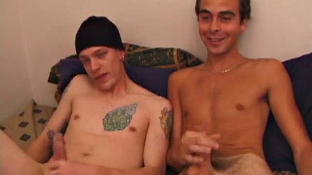 Shane and Vincenzo on the bed, with the goal to end up covering each other's faces in cum. They start watching a porn video and rub their stiff cocks through their pants. The clothes become too restraining and soon they come off.