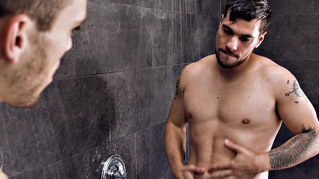 Athletic guy barebacks inked stud after shower