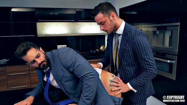 two suited men get soaked in the rain and fuck hard indoors