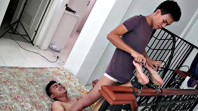 Cute Asian boy Lance returns in this foot tickling and tickle endurance combo. Lance's ankles are bound to the staircase banister. Warren tickles his feet.