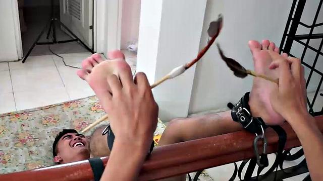 Cute Asian boy Lance returns in this foot tickling and tickle endurance combo. Lance's ankles are bound to the staircase banister. Warren tickles his feet.