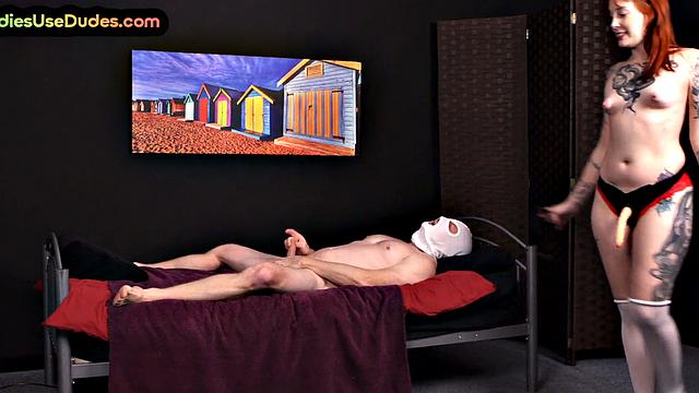 Redhead inked strapon domina pegs sub ass