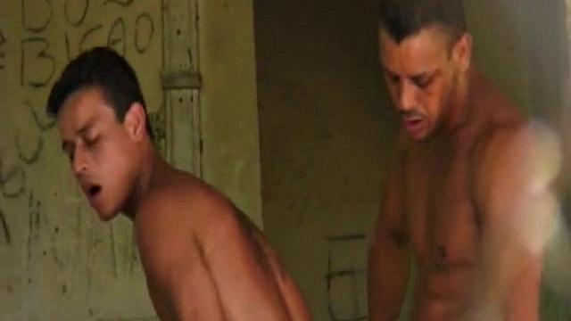 Brazilian buddies Antonio Pinto and Marco Santos walk through the jungle to the abandoned shack where they wait for hotties. Gomez Aguilar appears and puts on a dick slapping show.