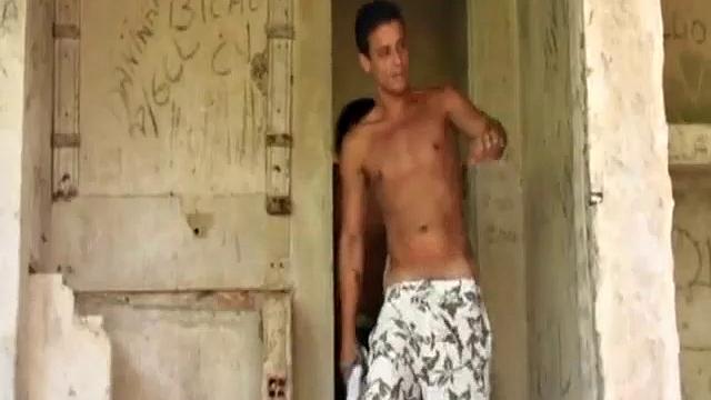 Brazilian buddies Antonio Pinto and Marco Santos walk through the jungle to the abandoned shack where they wait for hotties. Gomez Aguilar appears and puts on a dick slapping show.