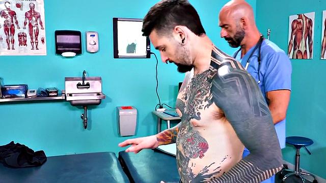 Fisting doctor fucks and fists jock in infirmary 3some