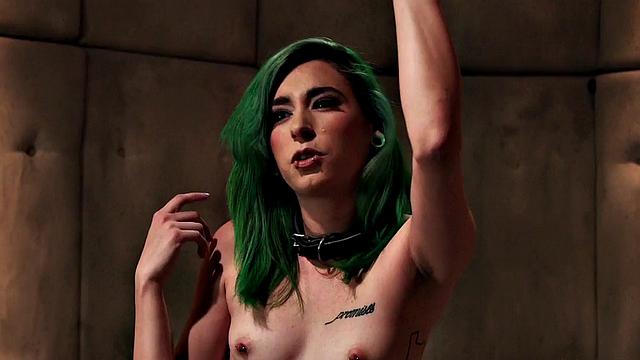 BDSM babe vibrates pussy while bound during class