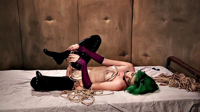 BDSM babe vibrates pussy while bound during class