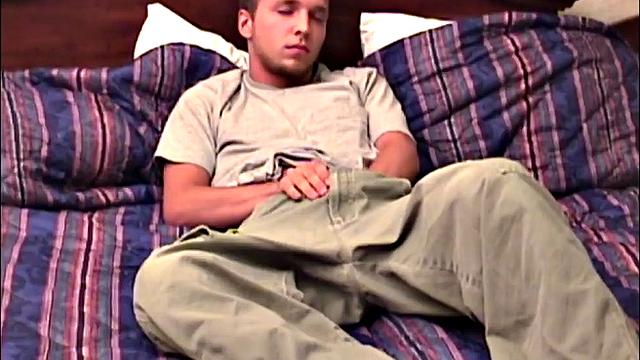 Pheonix is a sexy young man with a light beard and small patch of hair on his chest. He is the subject of Auntie Bob's next homemade video, which begins with him on the bed, working up a stiff one, as he strips naked.