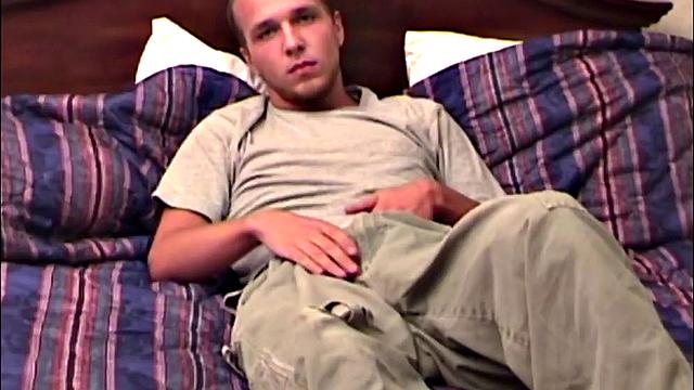 Pheonix is a sexy young man with a light beard and small patch of hair on his chest. He is the subject of Auntie Bob's next homemade video, which begins with him on the bed, working up a stiff one, as he strips naked.