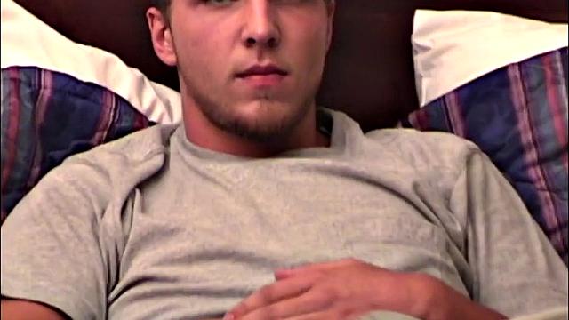 Pheonix is a sexy young man with a light beard and small patch of hair on his chest. He is the subject of Auntie Bob's next homemade video, which begins with him on the bed, working up a stiff one, as he strips naked.