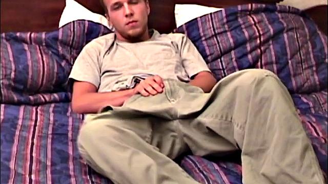 Pheonix is a sexy young man with a light beard and small patch of hair on his chest. He is the subject of Auntie Bob's next homemade video, which begins with him on the bed, working up a stiff one, as he strips naked.