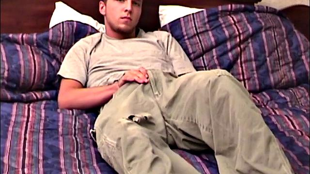 Pheonix is a sexy young man with a light beard and small patch of hair on his chest. He is the subject of Auntie Bob's next homemade video, which begins with him on the bed, working up a stiff one, as he strips naked.