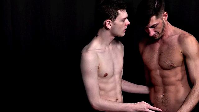 Bearded jock kissing sensually in jockstrap