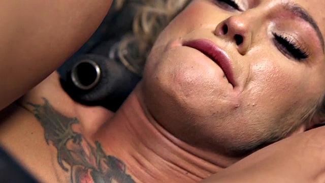 Kinky blonde submissive tied up and spanked by dominant while wearing gloves