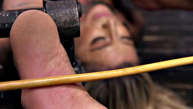 Kinky blonde submissive tied up and spanked by dominant while wearing gloves