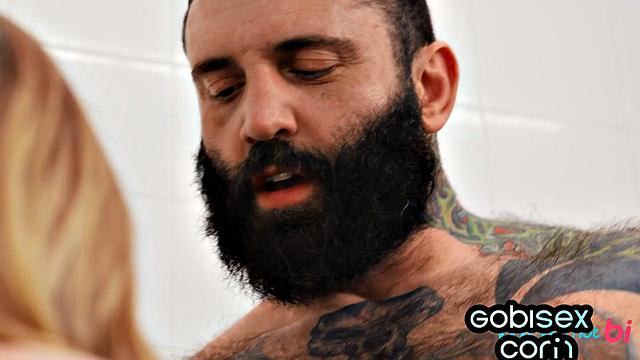 pierced babe gives head to 2 dicks