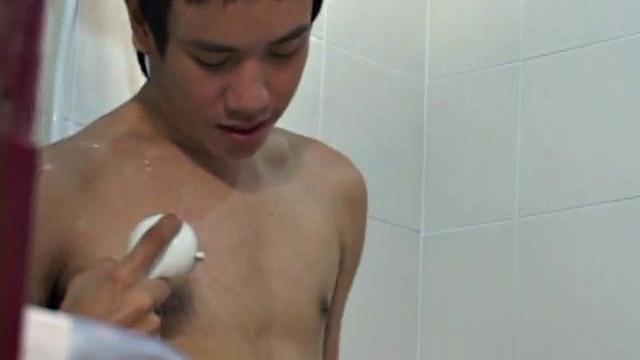 Showering Asian twinks exchanging before 69 on bed