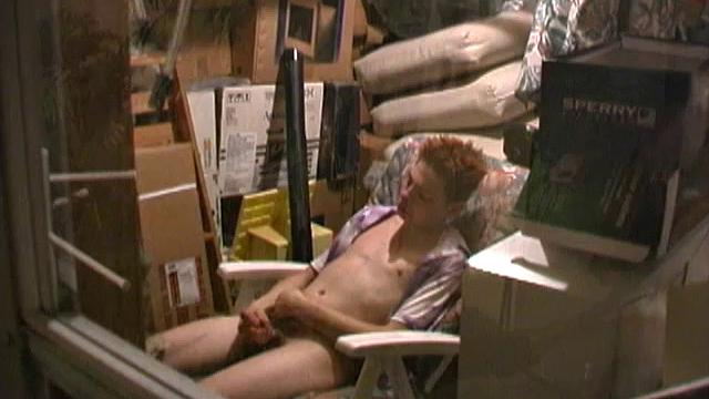 Redhead 18 year old skater Rusty Clark has found a comfortable chair in the storage room to drop his pants and jack off. This young man has a very high sex drive, so he's gotten good at finding places to quickly slip into and beat off.