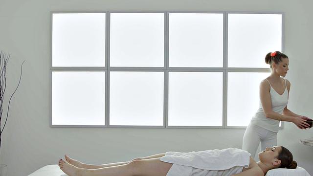 Massaging lesbians love eating pussies while fingering