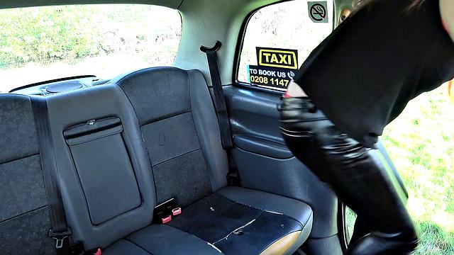 Ginger bush-haired babe with big tits takes a hard pounding in the backseat of a taxi