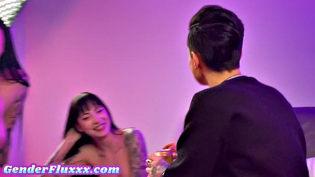 Inked genderfluid pounding with strapon