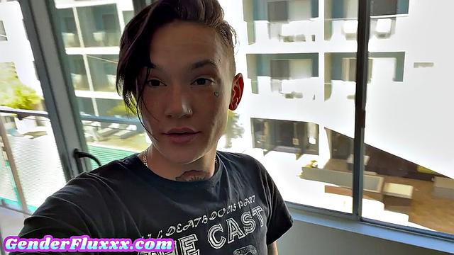 Inked genderfluid pounding with strapon