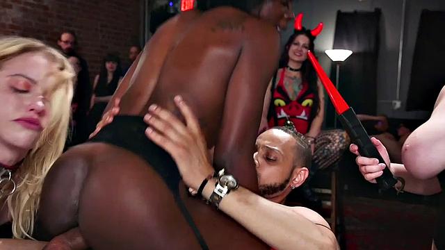 Public BDSM Ebony suffers electrosex in group BDSM action